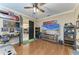 Bright living room with an open floorplan, hardwood floors, and ample natural light at 22235 Panther Loop, Bradenton, FL 34202