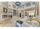Spacious living area with a stone fireplace and balcony overlooking at 22235 Panther Loop, Bradenton, FL 34202