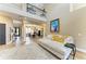 Living room featuring a balcony, high ceilings, and modern decor at 22235 Panther Loop, Bradenton, FL 34202