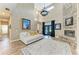 Bright living room with stone fireplace, high ceilings, and modern decor at 22235 Panther Loop, Bradenton, FL 34202