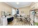 Bright office with natural lighting, dual desks, and a glam makeup vanity at 22235 Panther Loop, Bradenton, FL 34202