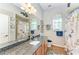 Bathroom with granite countertop, nautical-themed decor, and separate shower at 22333 Panther Loop, Bradenton, FL 34202