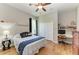 Comfortable bedroom with wood floors, nautical-themed decor, and a built-in desk area at 22333 Panther Loop, Bradenton, FL 34202