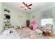 Playful bedroom with a tent, rocking chair, and whimsical decor at 22333 Panther Loop, Bradenton, FL 34202