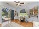 Bright, sunny bedroom with pool view, sewing area, and unique decorations at 22333 Panther Loop, Bradenton, FL 34202