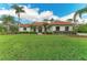 Charming exterior of home featuring meticulously landscaped front lawn at 22333 Panther Loop, Bradenton, FL 34202