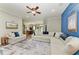 Comfortable living room with a large sectional sofa and coordinated decor, flowing seamlessly into the dining area at 22333 Panther Loop, Bradenton, FL 34202