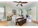 Light and bright main bedroom with wood flooring and private lanai access at 22333 Panther Loop, Bradenton, FL 34202