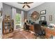 Home office with dual desk setup, wood floors, and natural light at 22333 Panther Loop, Bradenton, FL 34202