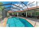 Large screened-in pool area with a brick paver deck offers a great outdoor living space at 22333 Panther Loop, Bradenton, FL 34202