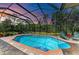 Sparkling pool with brick paver deck and a screened enclosure offering a private, outdoor oasis at 22333 Panther Loop, Bradenton, FL 34202