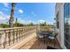 Outdoor balcony featuring a table and chairs perfect for relaxation and views at 2309 Avenue C # 100, Bradenton Beach, FL 34217