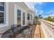 Relax on this balcony with table and chairs plus spiral stairs to the roof at 2309 Avenue C # 100, Bradenton Beach, FL 34217