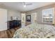 Bedroom featuring wood-look flooring, outdoor access and TV at 2309 Avenue C # 100, Bradenton Beach, FL 34217