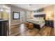 Bedroom featuring wood-look flooring, outdoor access and decorative elements at 2309 Avenue C # 100, Bradenton Beach, FL 34217
