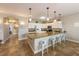 Well-equipped kitchen with a large island, bar seating, and modern appliances at 2309 Avenue C # 100, Bradenton Beach, FL 34217
