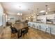 Spacious living and dining area with tiled floor, counter seating, and ample natural light at 2309 Avenue C # 100, Bradenton Beach, FL 34217