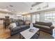 Open-concept living area featuring comfortable seating, a coffee table, and views of the kitchen and dining area at 2309 Avenue C # 100, Bradenton Beach, FL 34217