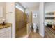 Bathroom with a glass shower, toilet, vanity, and modern fixtures at 2309 Avenue C # 200, Bradenton Beach, FL 34217