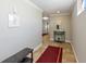 A brightly lit hallway with neutral-toned walls, tiled floors, and welcoming decor provides a smooth transition into the home at 2309 Avenue C # 200, Bradenton Beach, FL 34217