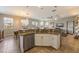 Open concept kitchen featuring stainless steel appliances, granite countertops, and adjacent dining area at 2309 Avenue C # 200, Bradenton Beach, FL 34217