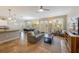 Open-concept living space with tile floors and neutral-colored furniture throughout at 2309 Avenue C # 200, Bradenton Beach, FL 34217