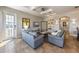 Comfortable living room featuring tile floors, recessed lighting, and access to the outdoor balcony at 2309 Avenue C # 200, Bradenton Beach, FL 34217