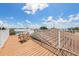 A beautiful rooftop deck is equipped with a privacy fence and has plenty of room for relaxing and enjoying the views at 2309 Avenue C # 200, Bradenton Beach, FL 34217