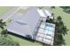 An aerial view of the property showcases the screened pool, patio, and landscaping surrounding the home at 2508 Belvoir Blvd, Sarasota, FL 34237