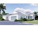 Charming home featuring an attached two car garage and gorgeous landscaping and walkway at 2508 Belvoir Blvd, Sarasota, FL 34237