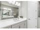 Elegant bathroom showcasing a double sink vanity, modern lighting, and a separate shower for a spa-like experience at 2894 Butterfly Jasmine Trl, Sarasota, FL 34240
