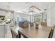 Bright dining area adjacent to a kitchen and living room with an airy feel at 2894 Butterfly Jasmine Trl, Sarasota, FL 34240