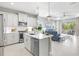 Modern kitchen seamlessly connects to the living room, enhancing the open floor plan at 2894 Butterfly Jasmine Trl, Sarasota, FL 34240
