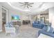 Bright open-concept living room features modern furnishings and abundant natural light at 2894 Butterfly Jasmine Trl, Sarasota, FL 34240