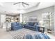 Bright open-concept living room connected to the kitchen with neutral tones and modern furnishings at 2894 Butterfly Jasmine Trl, Sarasota, FL 34240