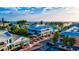 Quaint street view with vibrant buildings and palm trees creating a charming atmosphere at 2894 Butterfly Jasmine Trl, Sarasota, FL 34240