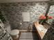 Unique bathroom with wallpaper, pedestal sink, and modern fixtures at 33 Tee View Pl, Rotonda West, FL 33947