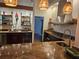 Modern kitchen with granite countertops, stainless steel appliances, and custom cabinetry at 33 Tee View Pl, Rotonda West, FL 33947