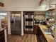 Modern kitchen featuring stainless steel appliances, granite counters, and custom cabinets with stylish decor at 33 Tee View Pl, Rotonda West, FL 33947