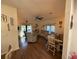 Comfortable living room with ample seating, ceiling fan, and natural light from sliding glass doors at 33 Tee View Pl, Rotonda West, FL 33947