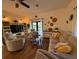Inviting living room with a plush sofa, armchairs, and a media center for cozy relaxation and entertainment at 33 Tee View Pl, Rotonda West, FL 33947