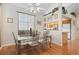 Cozy dining area featuring stylish chairs, a modern table and hardwood floors at 3883 Tampico Dr, Sarasota, FL 34235