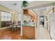 Charming kitchen with breakfast bar and stainless steel appliances is open to the dining area at 3883 Tampico Dr, Sarasota, FL 34235