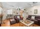 Open-concept living area featuring hardwood floors, vaulted ceilings, and seamless flow to the kitchen at 3883 Tampico Dr, Sarasota, FL 34235