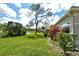 Beautiful backyard view, with lush green grass and scenic views of the pond at 3950 Oakley Greene # 36, Sarasota, FL 34235
