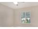 Neutral bedroom with a ceiling fan and window with blinds at 3950 Oakley Greene # 36, Sarasota, FL 34235