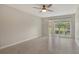 A clean, bright, and spacious primary bedroom with fan, neutral walls, and lots of natural light at 3950 Oakley Greene # 36, Sarasota, FL 34235