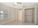 Bright bedroom with window shutters, closet, ceiling fan and tile flooring at 3950 Oakley Greene # 36, Sarasota, FL 34235