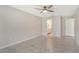 Neutral bedroom with tiled flooring, ceiling fan, and adjoining bathroom at 3950 Oakley Greene # 36, Sarasota, FL 34235