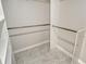 Walk-in closet with tiled floor, shelving, and hanging rods at 3950 Oakley Greene # 36, Sarasota, FL 34235